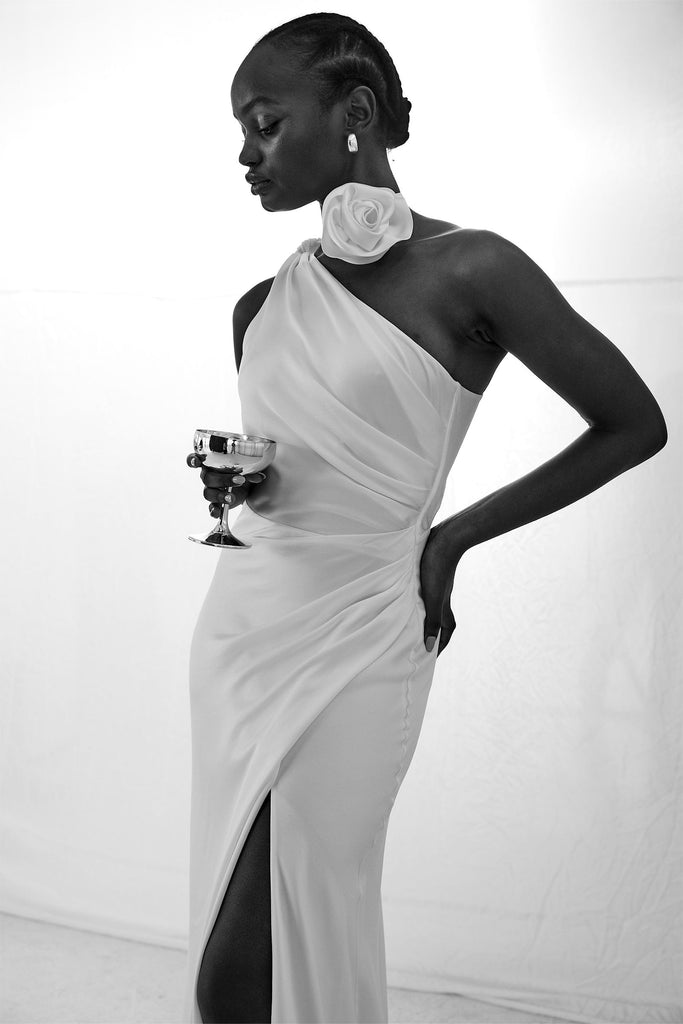 Campaign image of one shoulder gown wearing Ivory satin rose bridal choker necktie