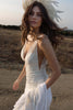 Model wearing the Dahlia gown with feathered hair accessory